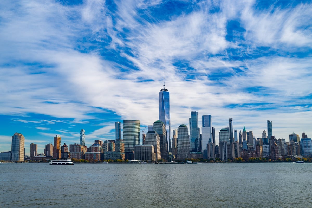 New York City skyline with skyscrapers and blue sky clouds